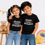 Chase Your Dreams Kids motivational Black T-Shirt (Models front)
